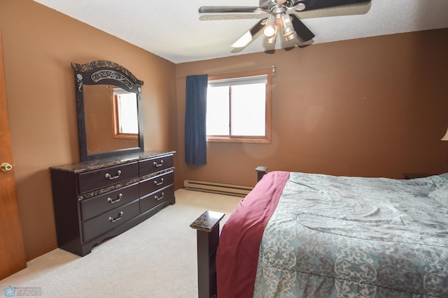 2515 25th St S Unit 303H, Fargo, ND 58103 - bedroom featuring baseboard heating, light colored carpet, and a ceiling fan