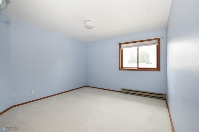 2515 25th St S Unit 303H, Fargo, ND 58103 - unfurnished room featuring a baseboard heating unit and carpet flooring