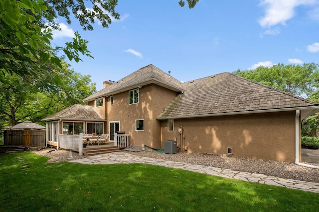 16209 Adeline Ln, Minnetonka, MN 55391 - back of property with stucco siding, a wooden deck, and a chimney