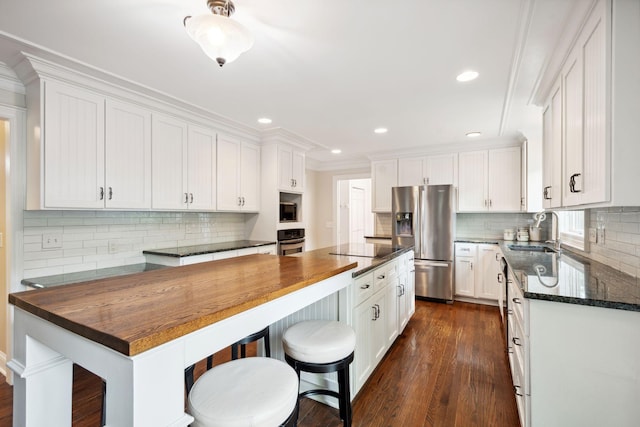 16209 Adeline Ln, Minnetonka, MN 55391 - kitchen with stainless steel appliances, decorative backsplash, white cabinets, dark wood-type flooring, and recessed lighting