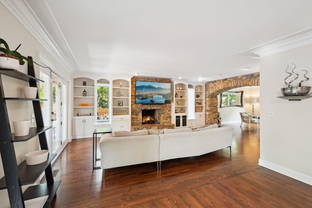 16209 Adeline Ln, Minnetonka, MN 55391 - living area with ornamental molding, a fireplace, arched walkways, built in shelves, and dark wood finished floors