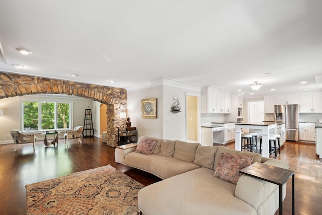 16209 Adeline Ln, Minnetonka, MN 55391 - living room with arched walkways, dark wood-style flooring, recessed lighting, and crown molding