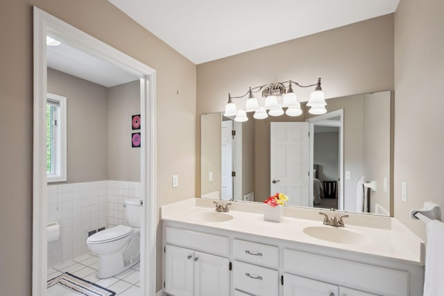 16209 Adeline Ln, Minnetonka, MN 55391 - full bathroom featuring tile patterned flooring, double vanity, tile walls, and wainscoting
