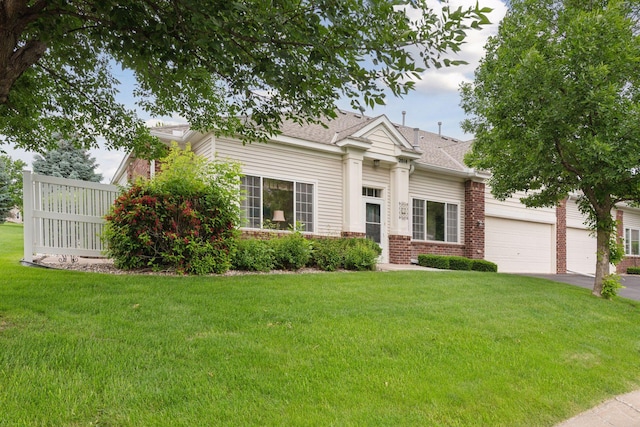2014 Stahlke Way, Chaska, MN 55318 - greek revival house featuring driveway, a front yard, brick siding, and roof with shingles