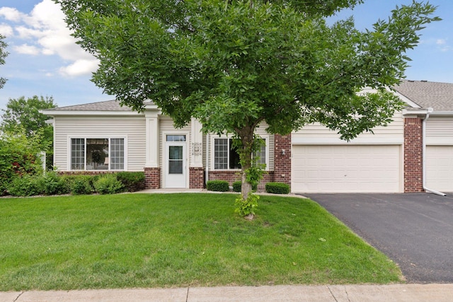2014 Stahlke Way, Chaska, MN 55318 - view of property hidden behind natural elements with brick siding, driveway, a front yard, an attached garage, and roof with shingles