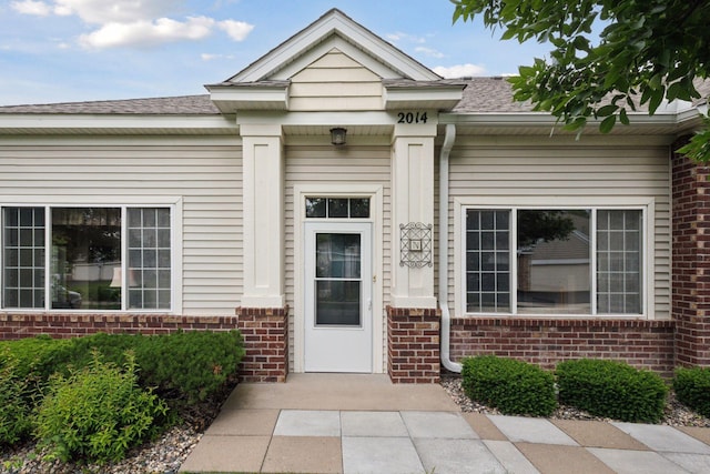 2014 Stahlke Way, Chaska, MN 55318 - doorway to property with brick siding and roof with shingles