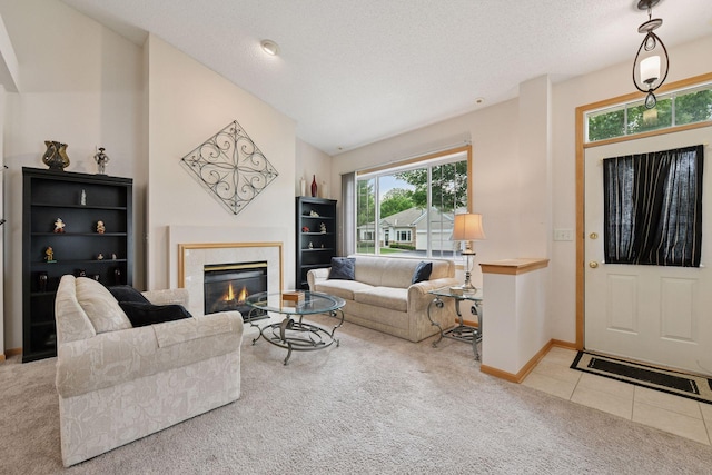 2014 Stahlke Way, Chaska, MN 55318 - carpeted living area with a glass covered fireplace, lofted ceiling, and tile patterned floors