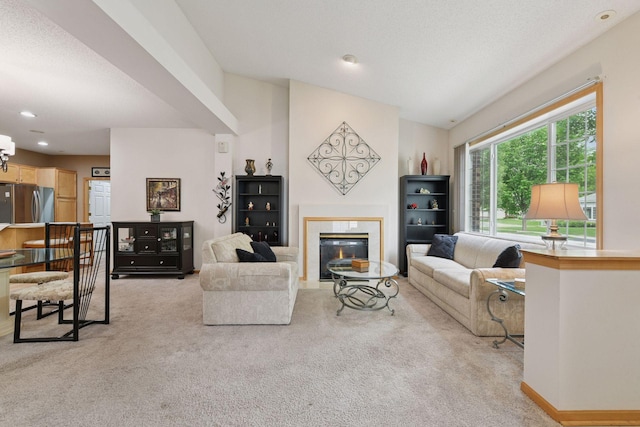 2014 Stahlke Way, Chaska, MN 55318 - living room featuring light carpet, a fireplace with flush hearth, and recessed lighting