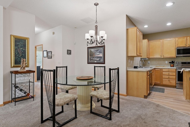 2014 Stahlke Way, Chaska, MN 55318 - dining room featuring light colored carpet, a chandelier, and recessed lighting