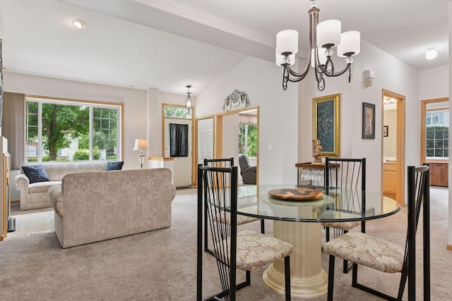 2014 Stahlke Way, Chaska, MN 55318 - dining space featuring light carpet, a chandelier, lofted ceiling, and a textured ceiling