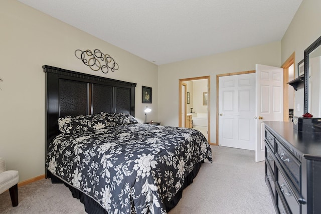 2014 Stahlke Way, Chaska, MN 55318 - carpeted bedroom featuring connected bathroom and baseboards
