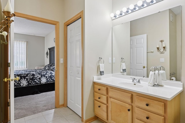 2014 Stahlke Way, Chaska, MN 55318 - bathroom with ensuite bathroom, vanity, tile patterned floors, and a textured ceiling