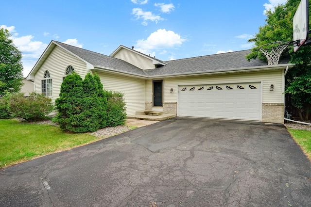 382 Tuttle Dr, Hastings, MN 55033 - ranch-style house featuring brick siding, driveway, an attached garage, and a shingled roof