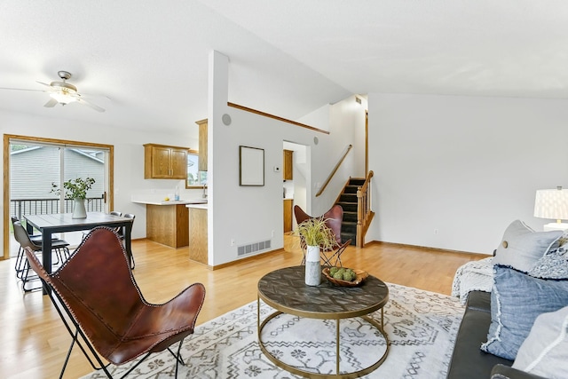 382 Tuttle Dr, Hastings, MN 55033 - living area featuring stairs, ceiling fan, light wood finished floors, and lofted ceiling