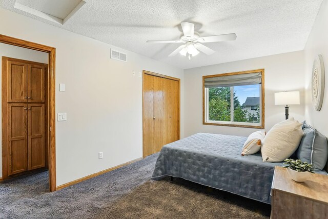 382 Tuttle Dr, Hastings, MN 55033 - bedroom with attic access, dark colored carpet, a textured ceiling, ceiling fan, and a closet