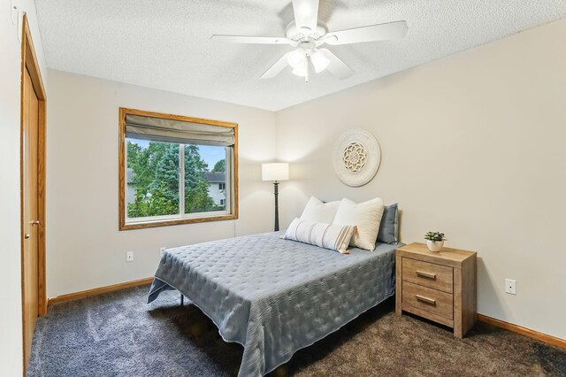 382 Tuttle Dr, Hastings, MN 55033 - bedroom featuring dark carpet, a textured ceiling, and ceiling fan