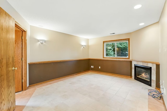 382 Tuttle Dr, Hastings, MN 55033 - unfurnished living room featuring a fireplace, recessed lighting, and light tile patterned floors