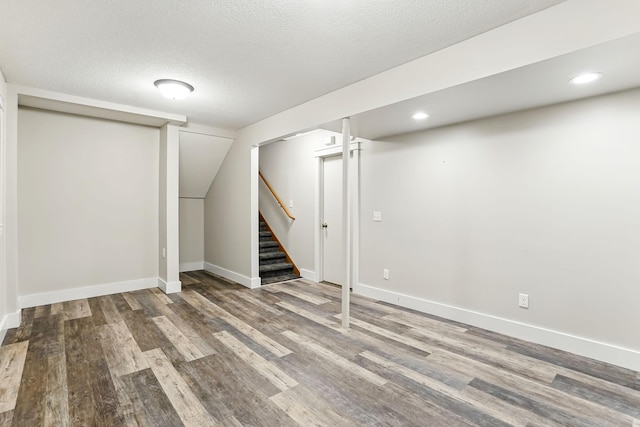 382 Tuttle Dr, Hastings, MN 55033 - finished basement featuring wood finished floors, stairway, a textured ceiling, and recessed lighting