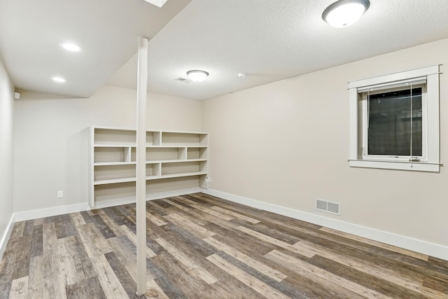 382 Tuttle Dr, Hastings, MN 55033 - finished below grade area featuring wood finished floors and a textured ceiling