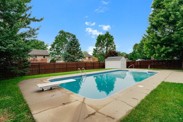 382 Tuttle Dr, Hastings, MN 55033 - view of pool featuring a fenced backyard, a storage shed, a patio area, and a diving board