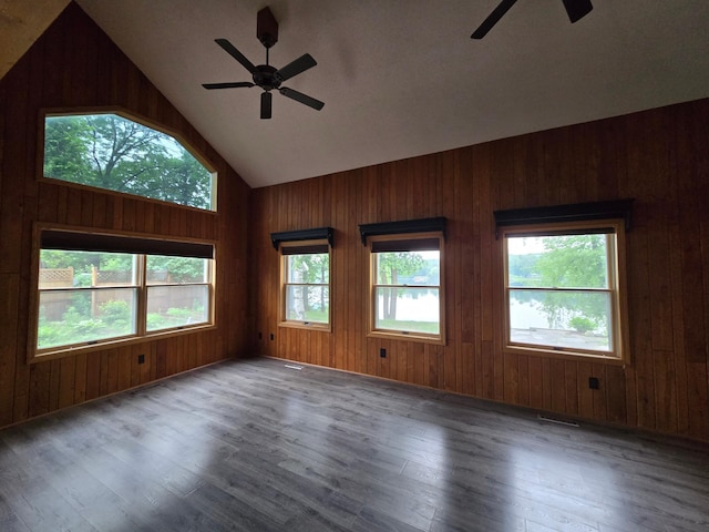 27891 Jerboa Ln, Cold Spring, MN 56320 - spare room featuring ceiling fan, wood finished floors, wooden walls, and high vaulted ceiling