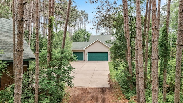 17121 Variolite St NW, Ramsey, MN 55303 - view of front facade featuring an attached garage, concrete driveway, and a shingled roof