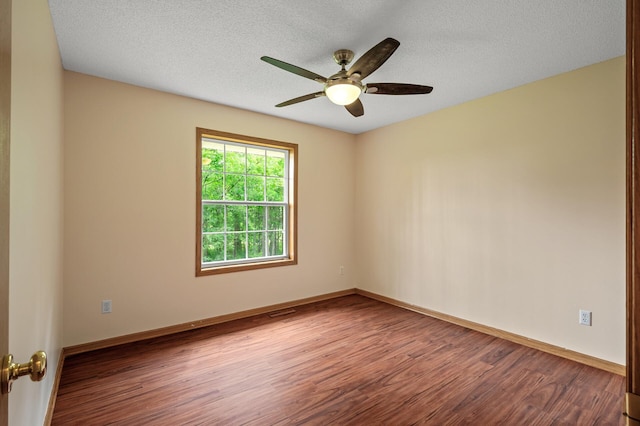 17121 Variolite St NW, Ramsey, MN 55303 - spare room with wood finished floors, ceiling fan, and a textured ceiling