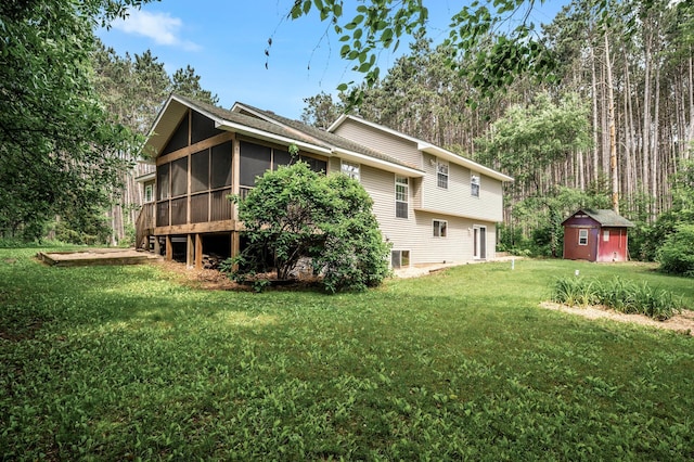 17121 Variolite St NW, Ramsey, MN 55303 - rear view of property with a sunroom, a shed, and a yard