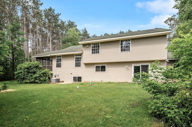 17121 Variolite St NW, Ramsey, MN 55303 - rear view of house with a sunroom and a lawn