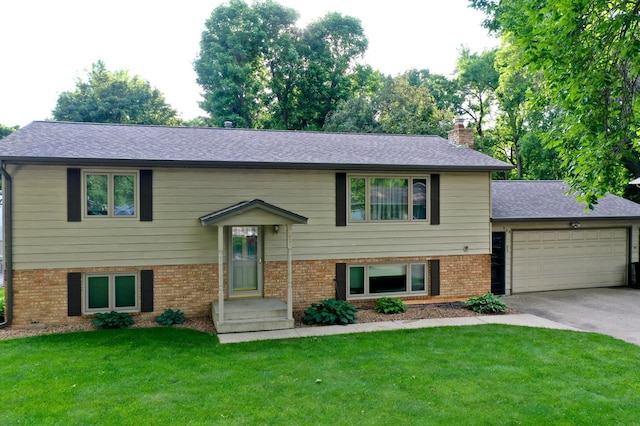 808 17th St SW, Willmar, MN 56201 - bi-level home with brick siding, driveway, a garage, and a chimney