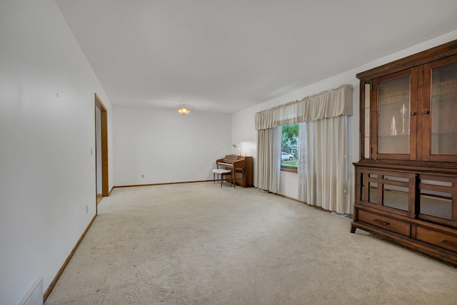 808 17th St SW, Willmar, MN 56201 - unfurnished room with light carpet and baseboards