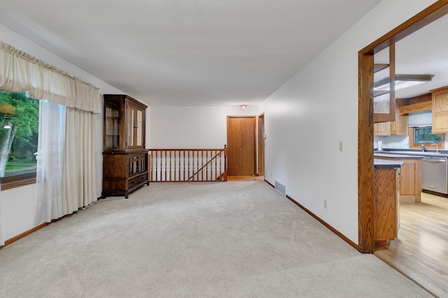 808 17th St SW, Willmar, MN 56201 - empty room featuring light colored carpet and baseboards