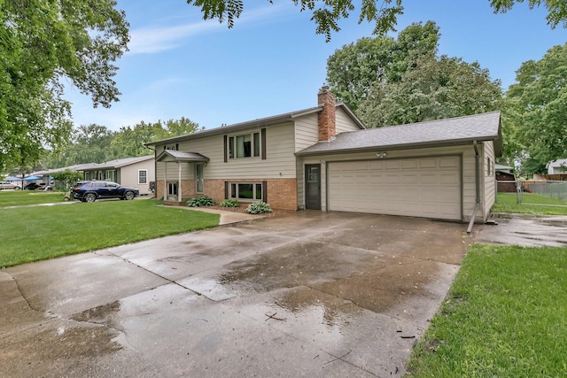808 17th St SW, Willmar, MN 56201 - view of front of house featuring driveway, a garage, a front yard, a chimney, and brick siding