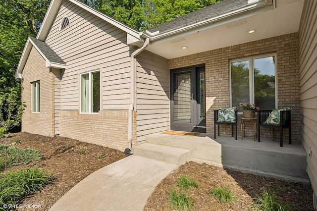 820 Vineland Ct, Chanhassen, MN 55317 - view of exterior entry featuring brick siding and roof with shingles