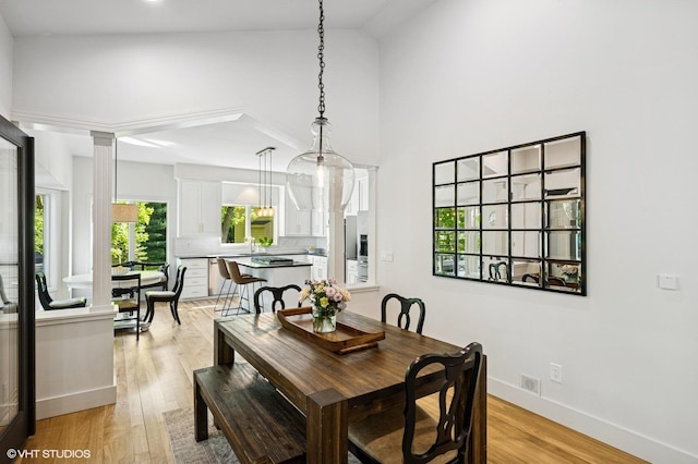 820 Vineland Ct, Chanhassen, MN 55317 - dining area featuring a towering ceiling and light wood-type flooring