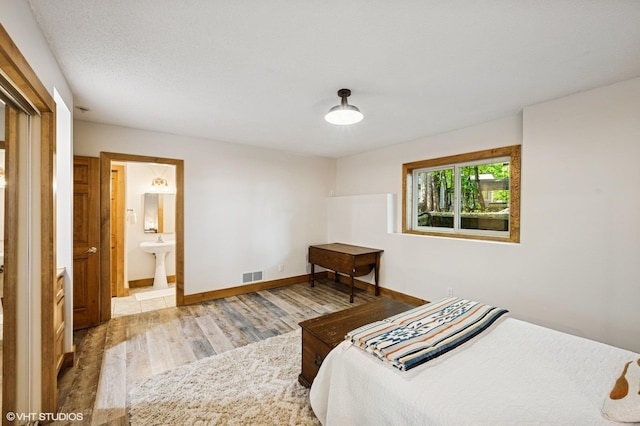 820 Vineland Ct, Chanhassen, MN 55317 - bedroom with wood finished floors and ensuite bathroom