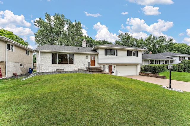 354 Edith Dr W, Saint Paul, MN 55118 - split level home with a chimney, a garage, a front yard, and driveway