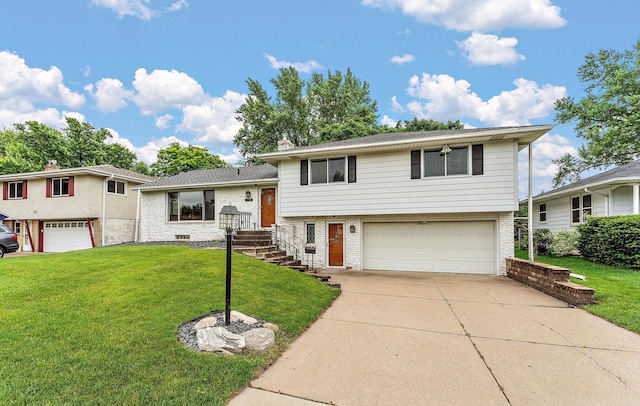 354 Edith Dr W, Saint Paul, MN 55118 - tri-level home featuring a garage, brick siding, concrete driveway, and a front yard