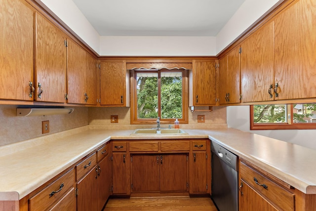 354 Edith Dr W, Saint Paul, MN 55118 - kitchen featuring stainless steel dishwasher, brown cabinets, light countertops, and light wood-style flooring