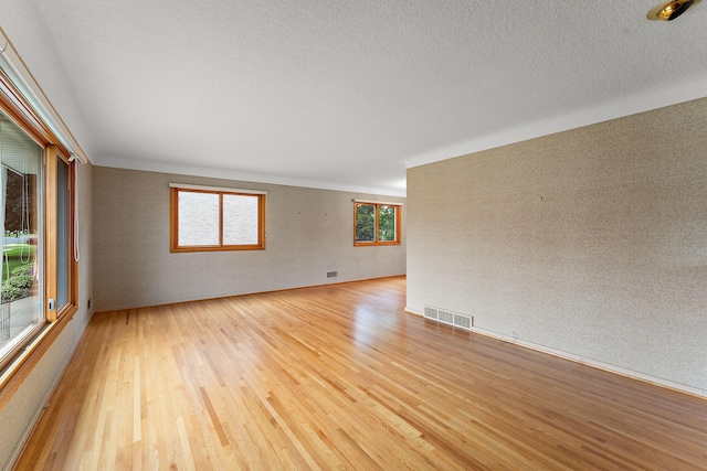 354 Edith Dr W, Saint Paul, MN 55118 - unfurnished room with light wood-style flooring and a textured ceiling
