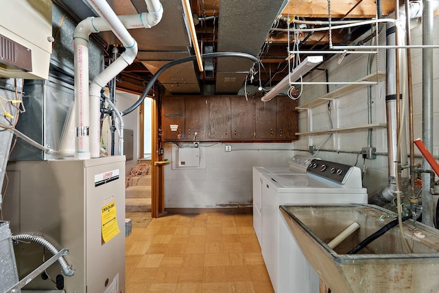 354 Edith Dr W, Saint Paul, MN 55118 - laundry room featuring washing machine and clothes dryer, light flooring, and concrete block wall