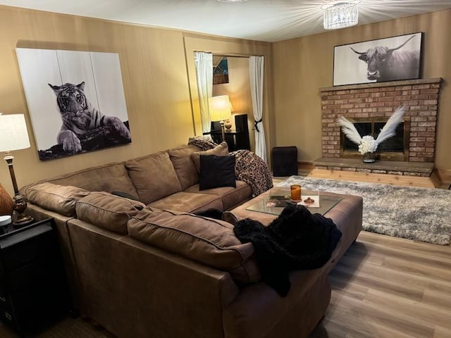 1439 7th St SW, New Brighton, MN 55112 - living room featuring wood finished floors and a fireplace