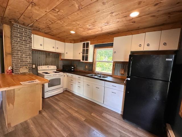 4623 Salo Rd, Waasa Twp, MN 55732 - kitchen with white range with electric stovetop, freestanding refrigerator, wooden ceiling, dark wood finished floors, and white cabinetry