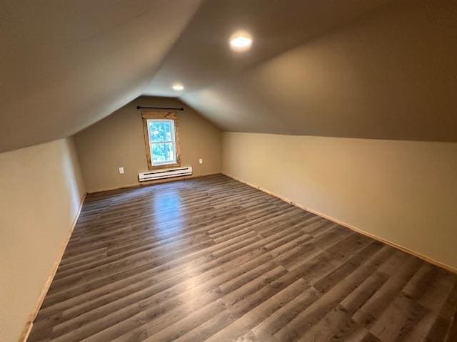 4623 Salo Rd, Waasa Twp, MN 55732 - bonus room with a baseboard radiator, dark wood-style floors, lofted ceiling, and recessed lighting