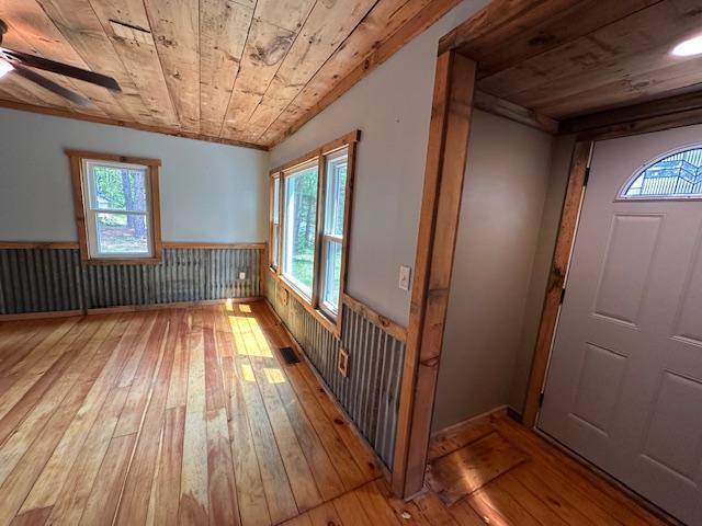 4623 Salo Rd, Waasa Twp, MN 55732 - entryway featuring hardwood / wood-style floors, wooden ceiling, wainscoting, plenty of natural light, and ceiling fan