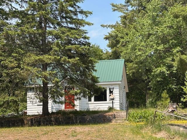 4623 Salo Rd, Waasa Twp, MN 55732 - view of property exterior featuring a metal roof