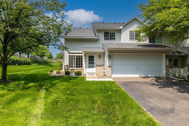 8741 Quarry Ridge Ln Unit H, Woodbury, MN 55125 - view of front of property with driveway, a front lawn, a garage, brick siding, and a shingled roof