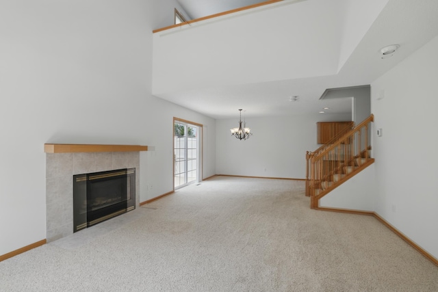 8741 Quarry Ridge Ln Unit H, Woodbury, MN 55125 - unfurnished living room with a chandelier, carpet flooring, and stairway