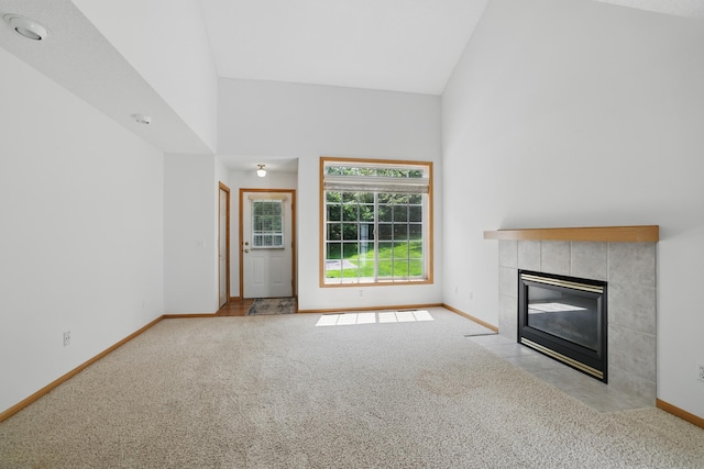 8741 Quarry Ridge Ln Unit H, Woodbury, MN 55125 - unfurnished living room with light colored carpet, high vaulted ceiling, and a fireplace