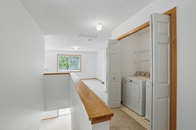 8741 Quarry Ridge Ln Unit H, Woodbury, MN 55125 - laundry area with attic access and washer and clothes dryer